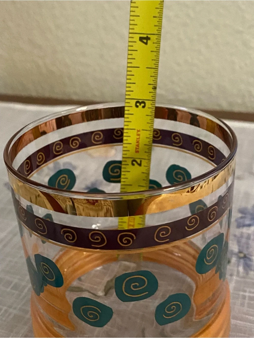 Sakura Gold-Trimmed Glass Tumbler with Teal Spirals and Copper Base